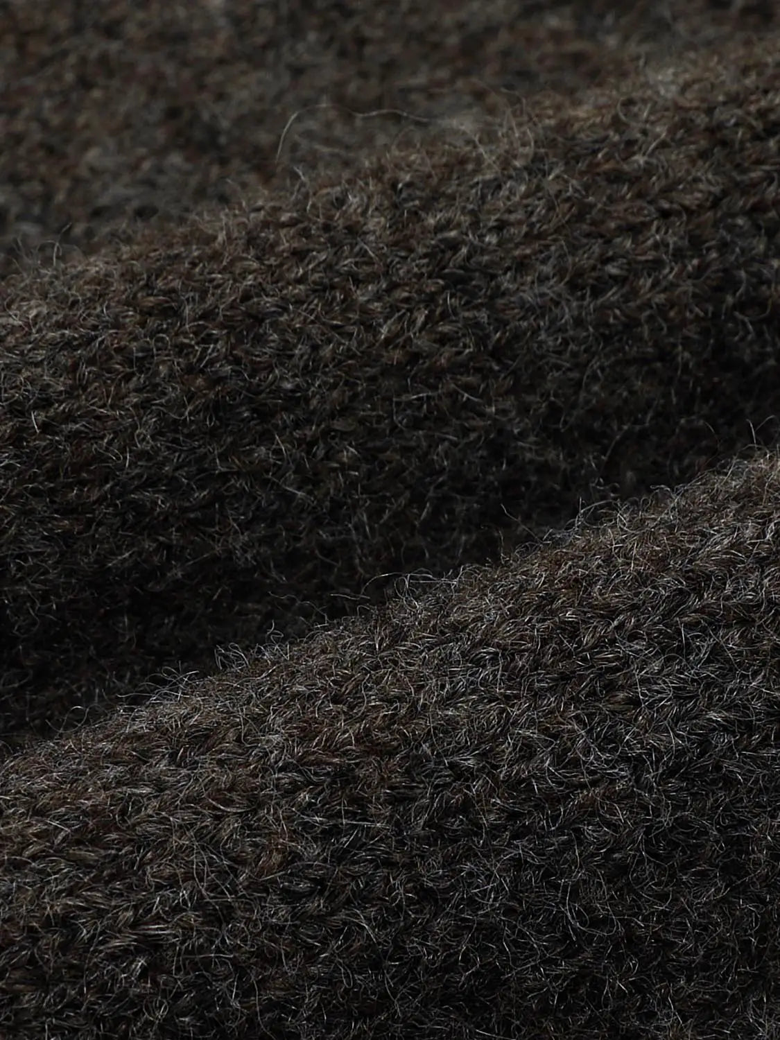 Knit T-Shirt fabric close-up in dark brown with soft, fuzzy fibers.