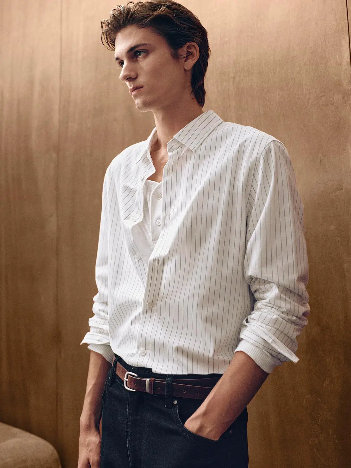 Striped Shirt Collar Long Sleeve Cotton Shirt in white with thin blue pinstripes; paired with dark denim jeans and brown belt.