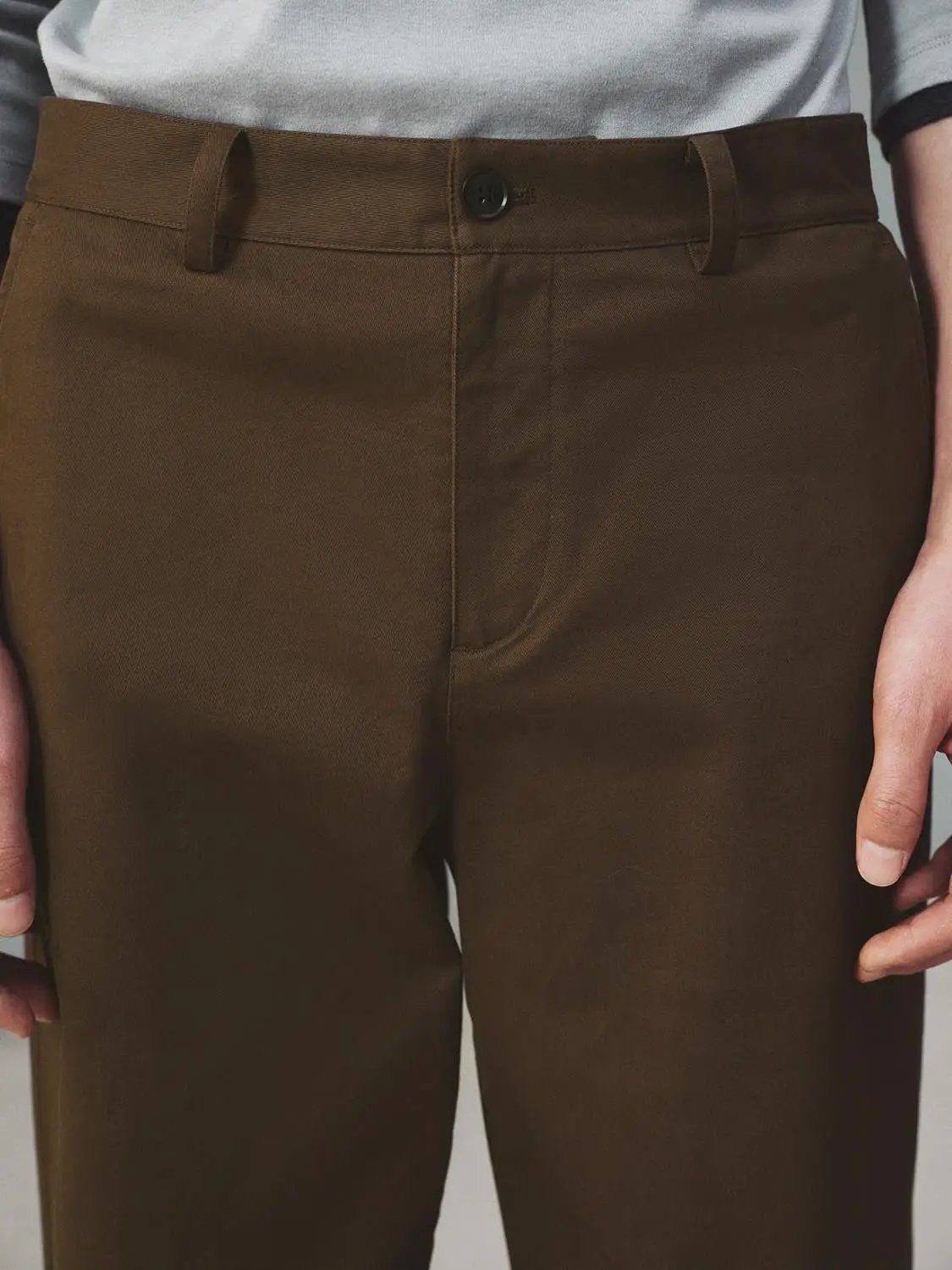 Straight-Leg Pants in brown with belt loops and front button.