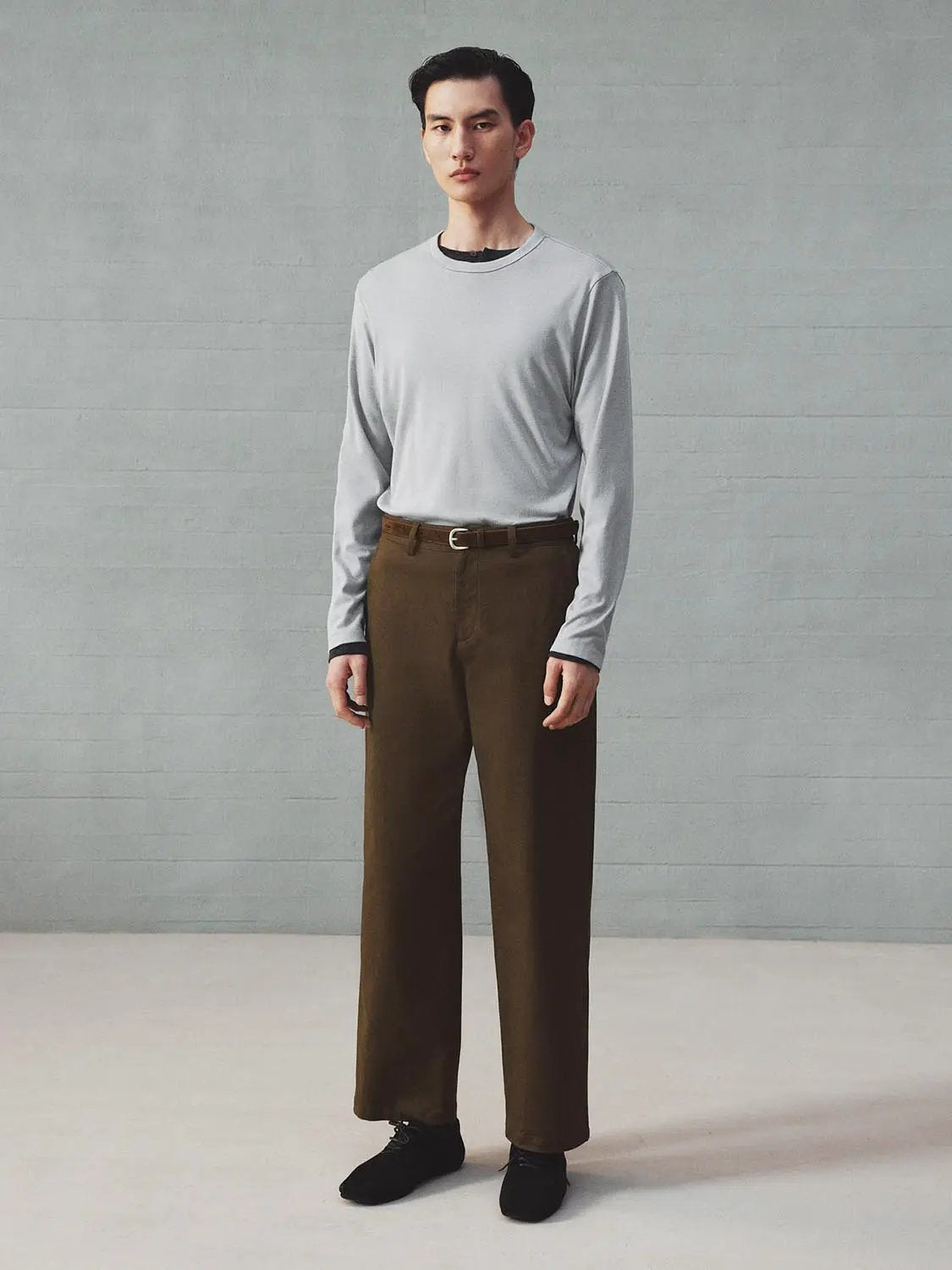 Straight-Leg Pants in brown with belt, full-length view on a male model.