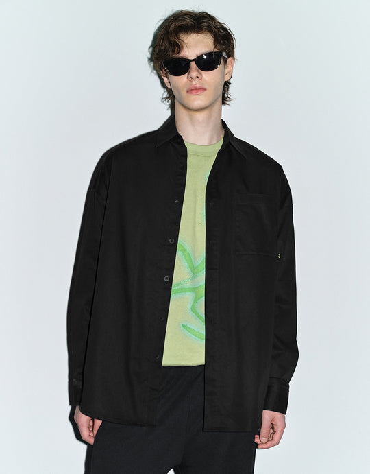 Camisa oversize con mangas y hombros caídos