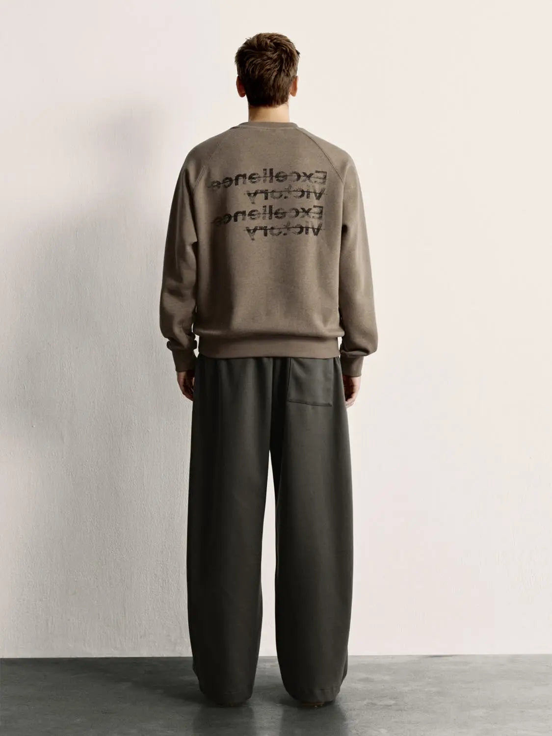 Sweatshirt in taupe with Urban Revivo Fashion back graphic text.