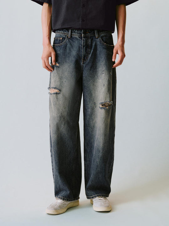 Jeans aus Baumwolle mit Used- und Bleicheffekt und weitem Bein