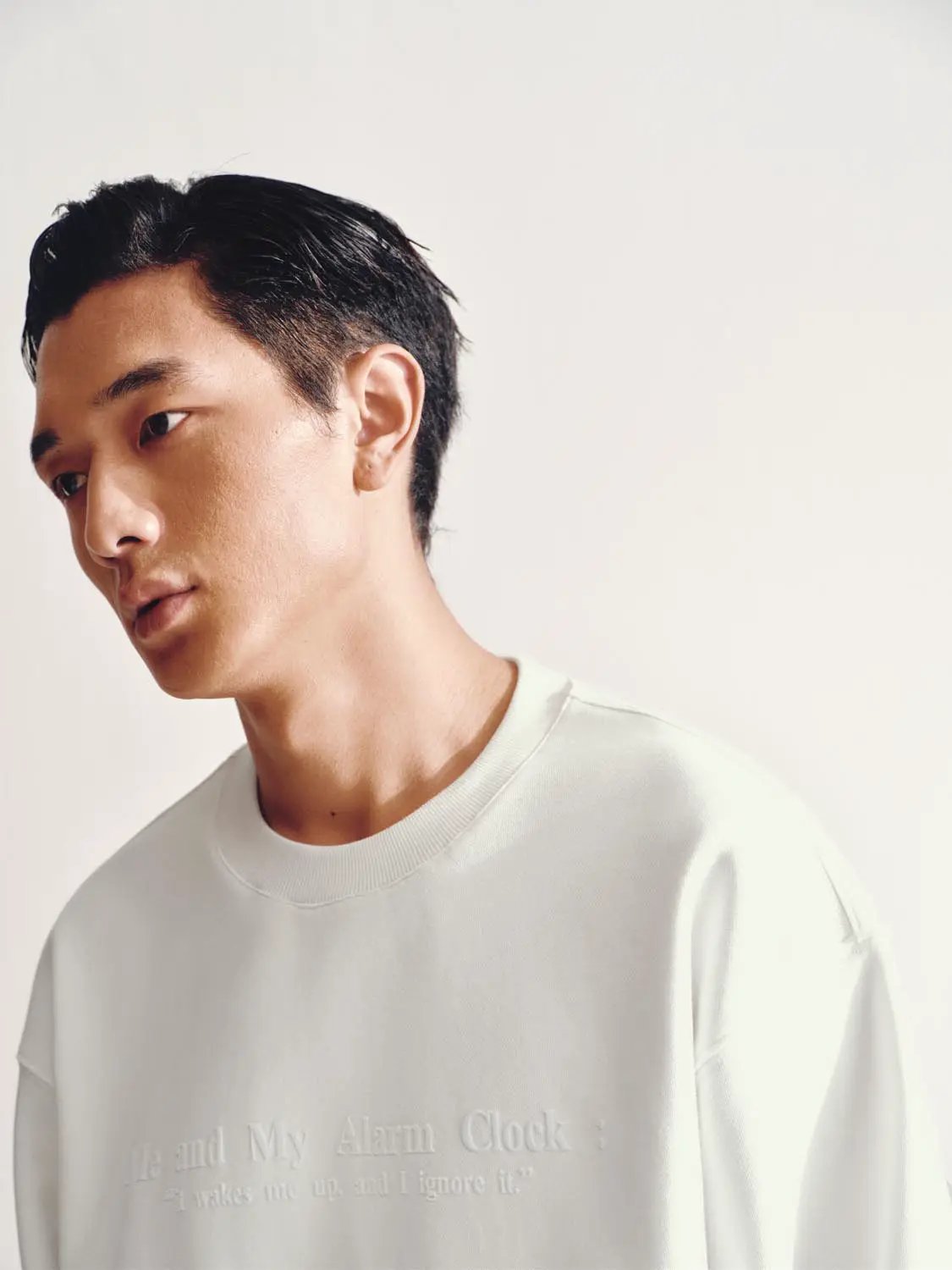 Urban Revivo Fashion white crewneck sweatshirt with subtle embossed chest text