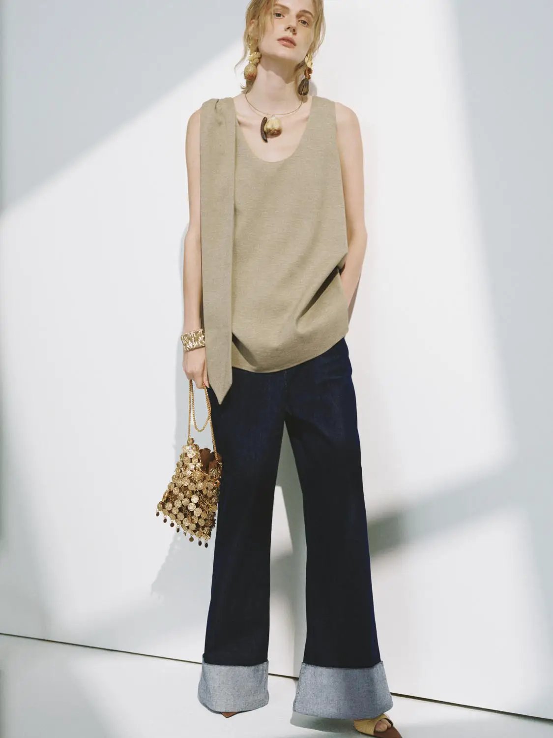 Textured draped-overlay beige sleeveless blouse by Urban Revivo Fashion