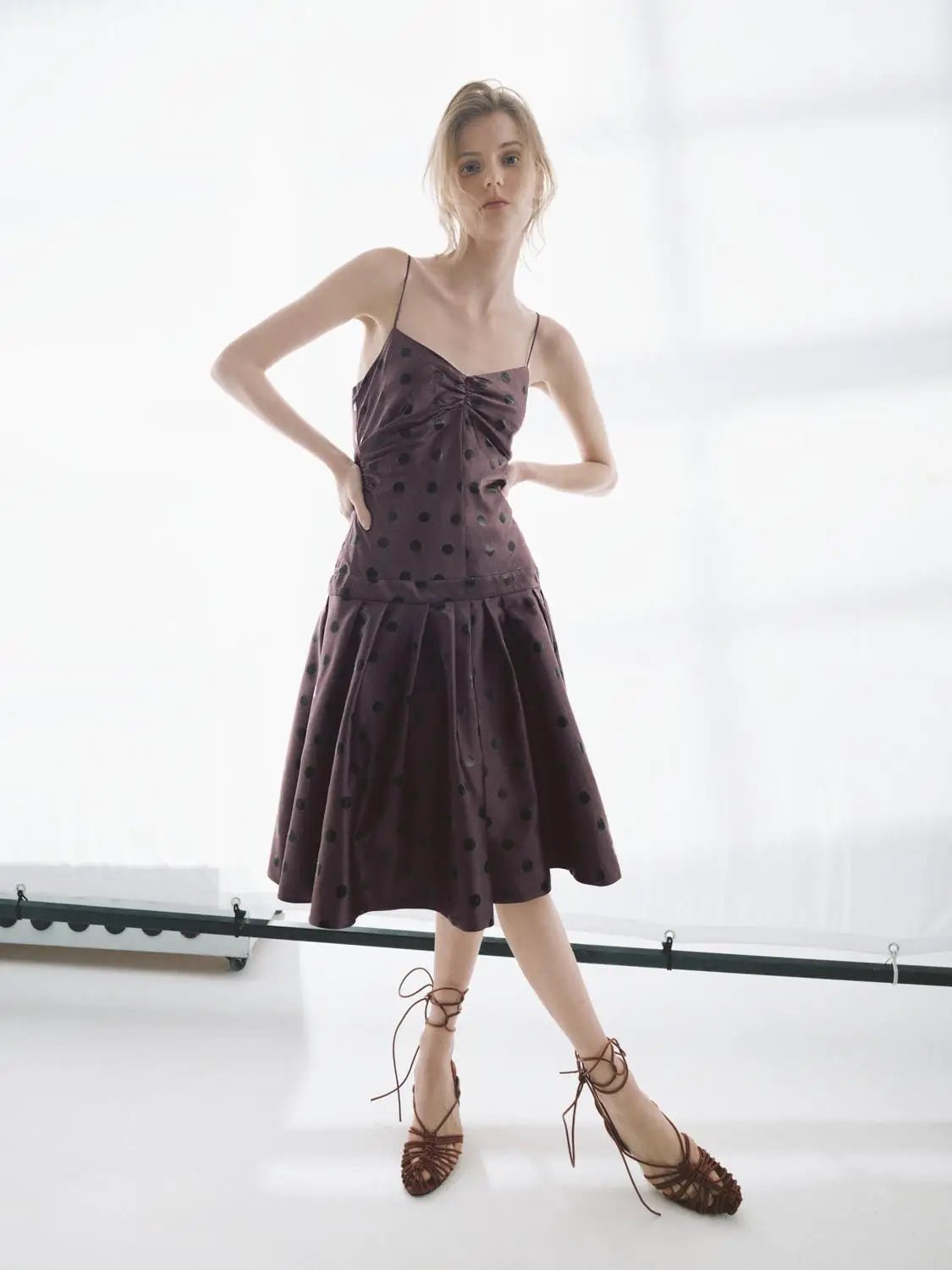 A-Line dress in plum with black polka dots, spaghetti straps, midi length.