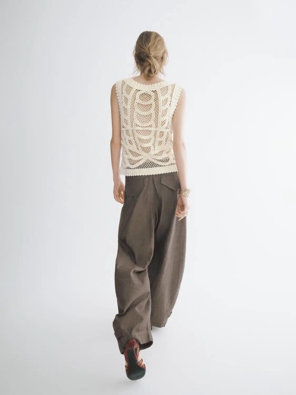 Textured openwork crochet knit cotton sleeveless T-shirt in cream.