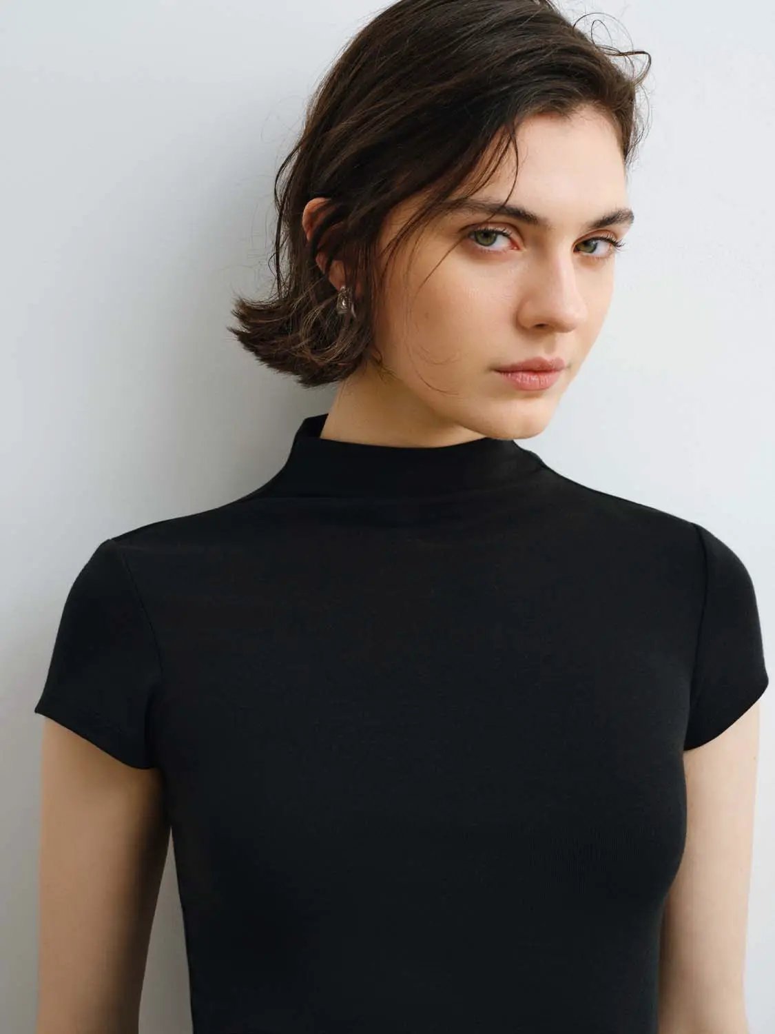 Modal knit T-shirt in black with short sleeves and smooth finish; medium-weight silhouette