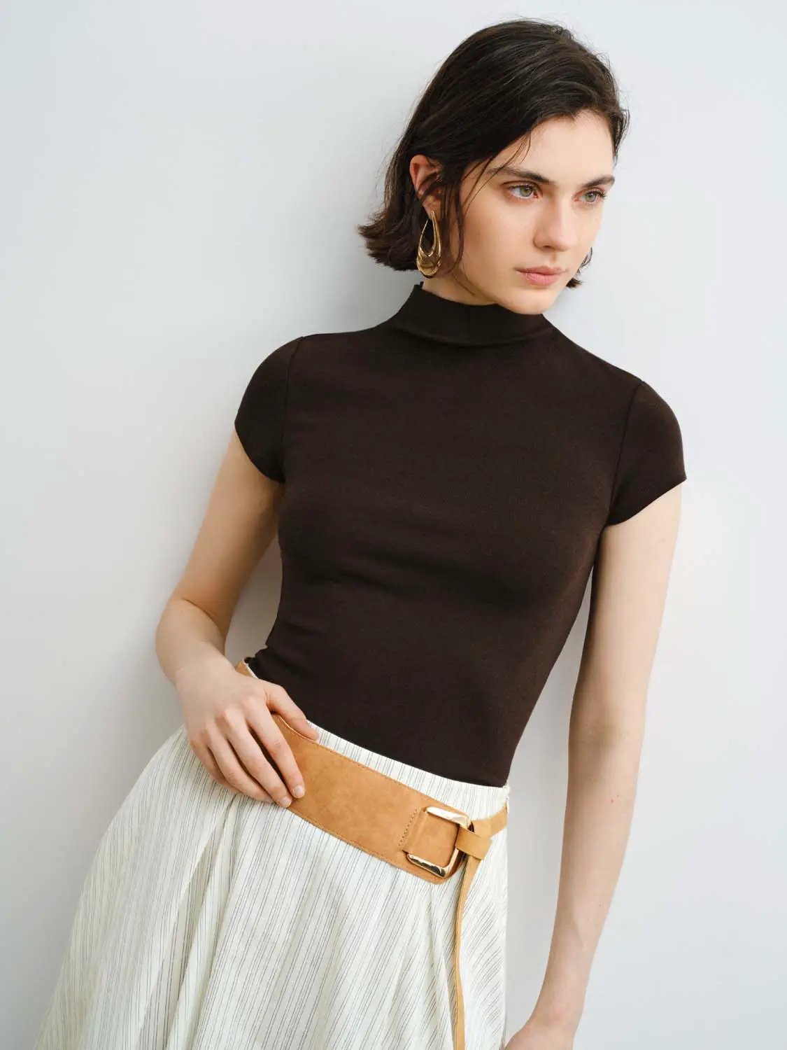 Women's dark brown modal-knit T-shirt with smooth finish and short sleeves.