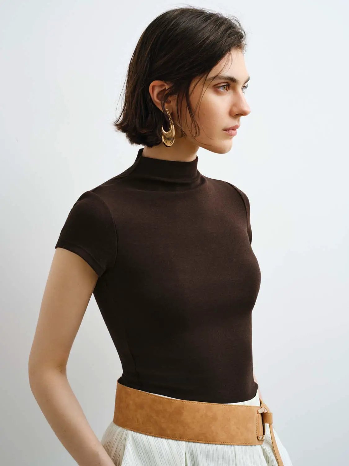 Women's brown modal-knit T-shirt with smooth finish and fitted silhouette.