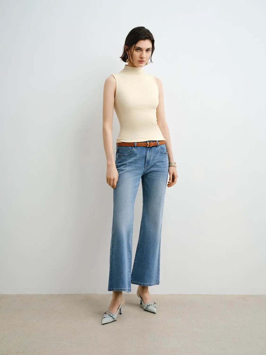 Tank Top by Urban Revivo Fashion, beige sleeveless high-neck tank top, paired with blue jeans.