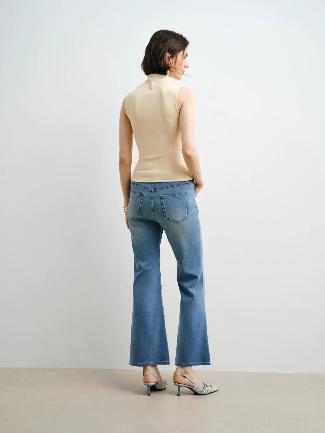 Tank top beige sleeveless by Urban Revivo Fashion; paired with blue jeans.