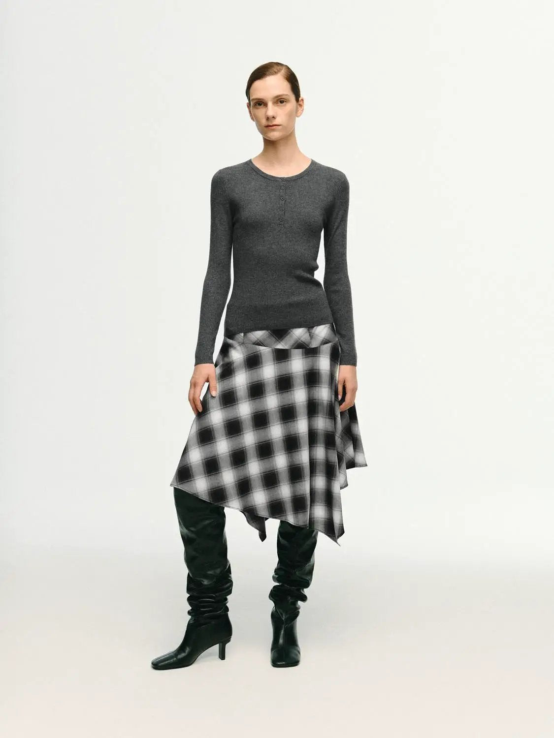 Slim ribbed button-front long-sleeve knit top in charcoal gray; paired with black-and-white plaid skirt.