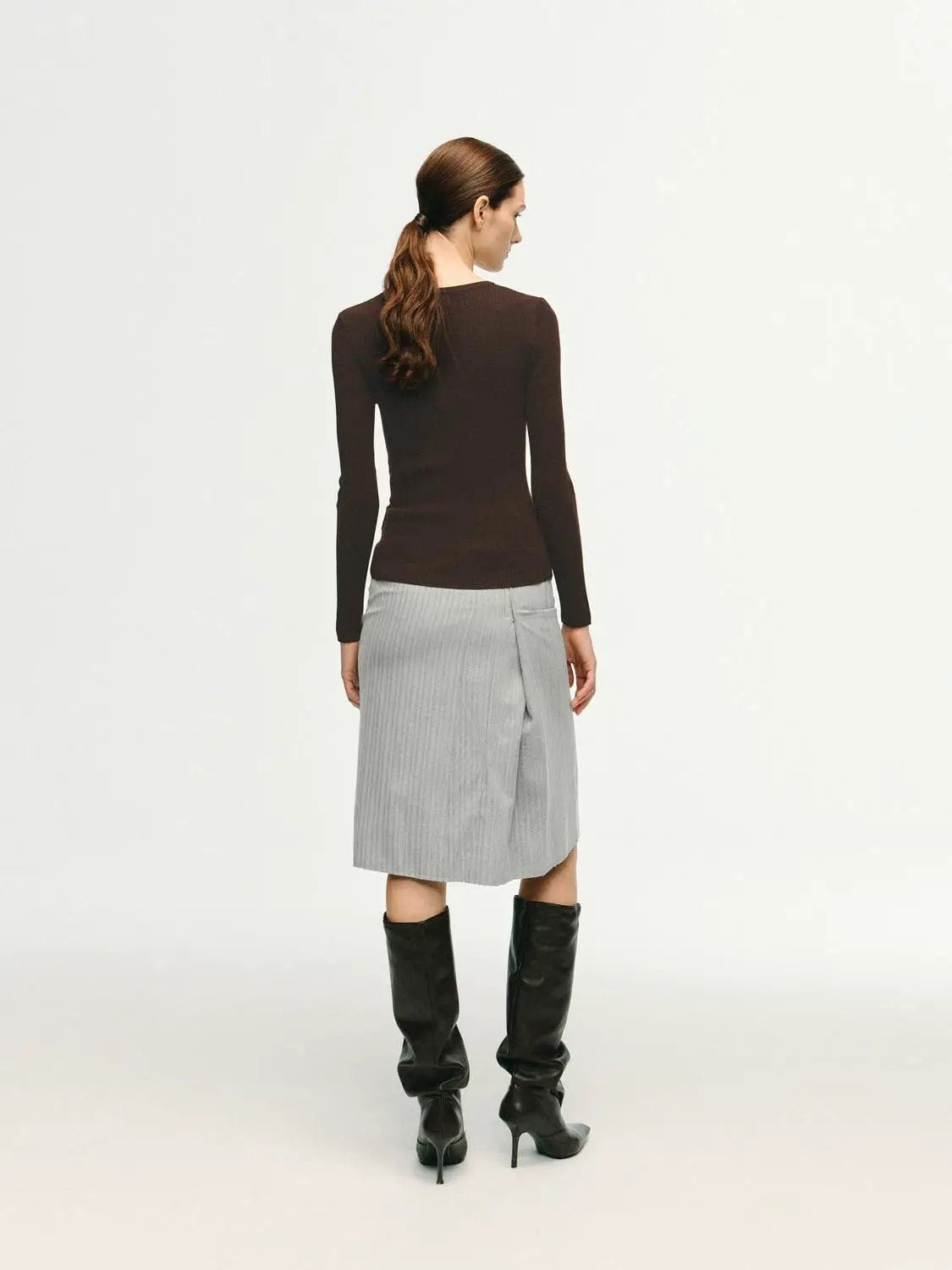 Slim ribbed button-front long-sleeve T-shirt in brown, paired with a light gray wrap-front skirt