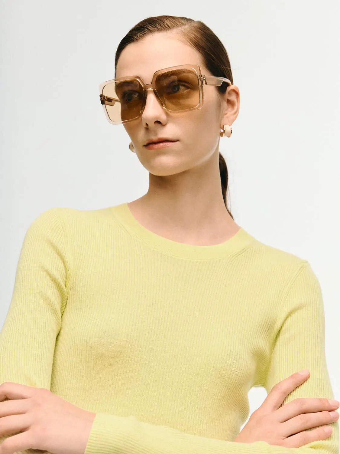 Ribbed fitted long sleeve crew-neck knit T-shirt in pale yellow.