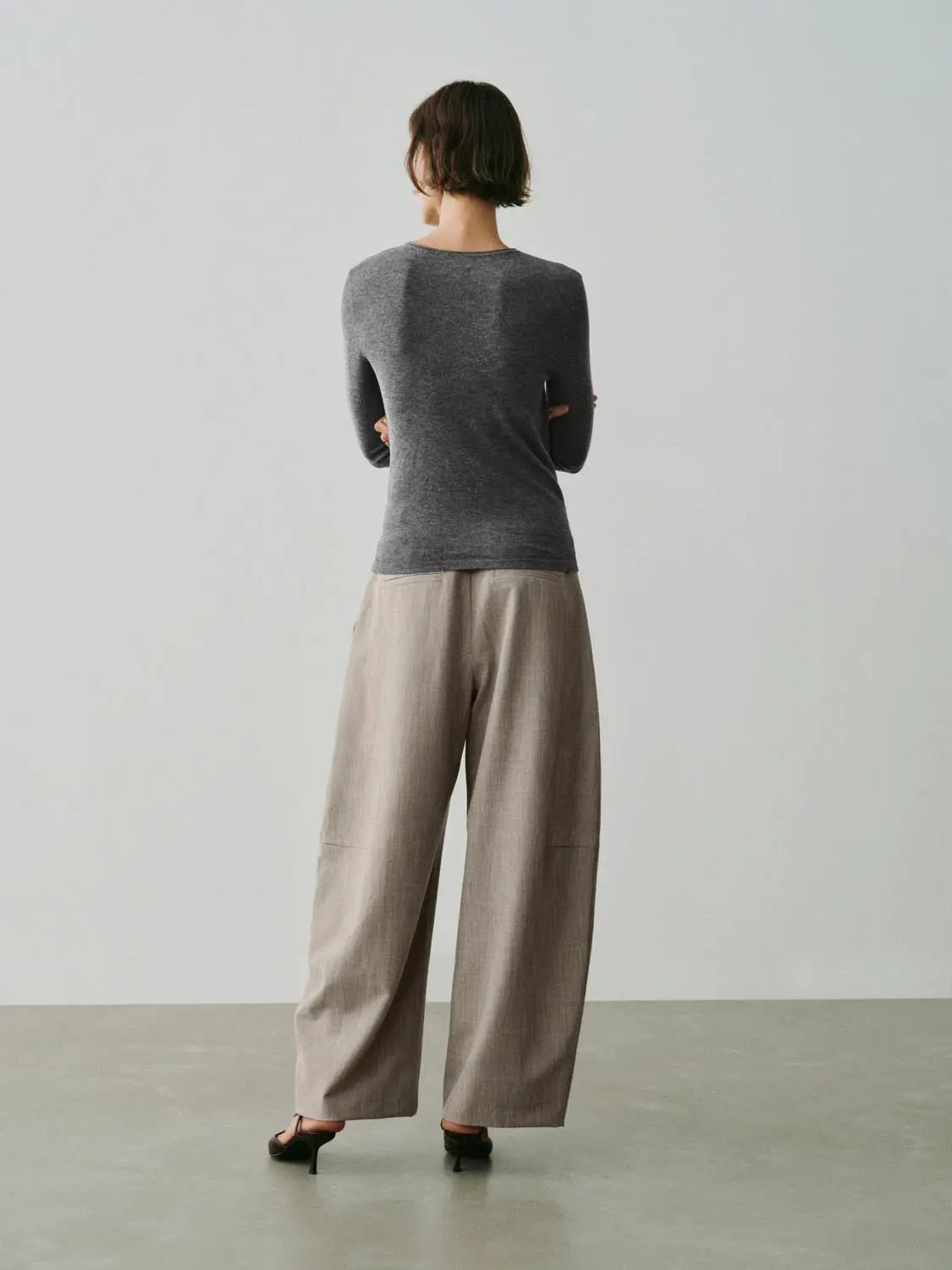 Knit T-Shirt by Urban Revivo Fashion; charcoal gray knit top with beige wide-leg pants, back view
