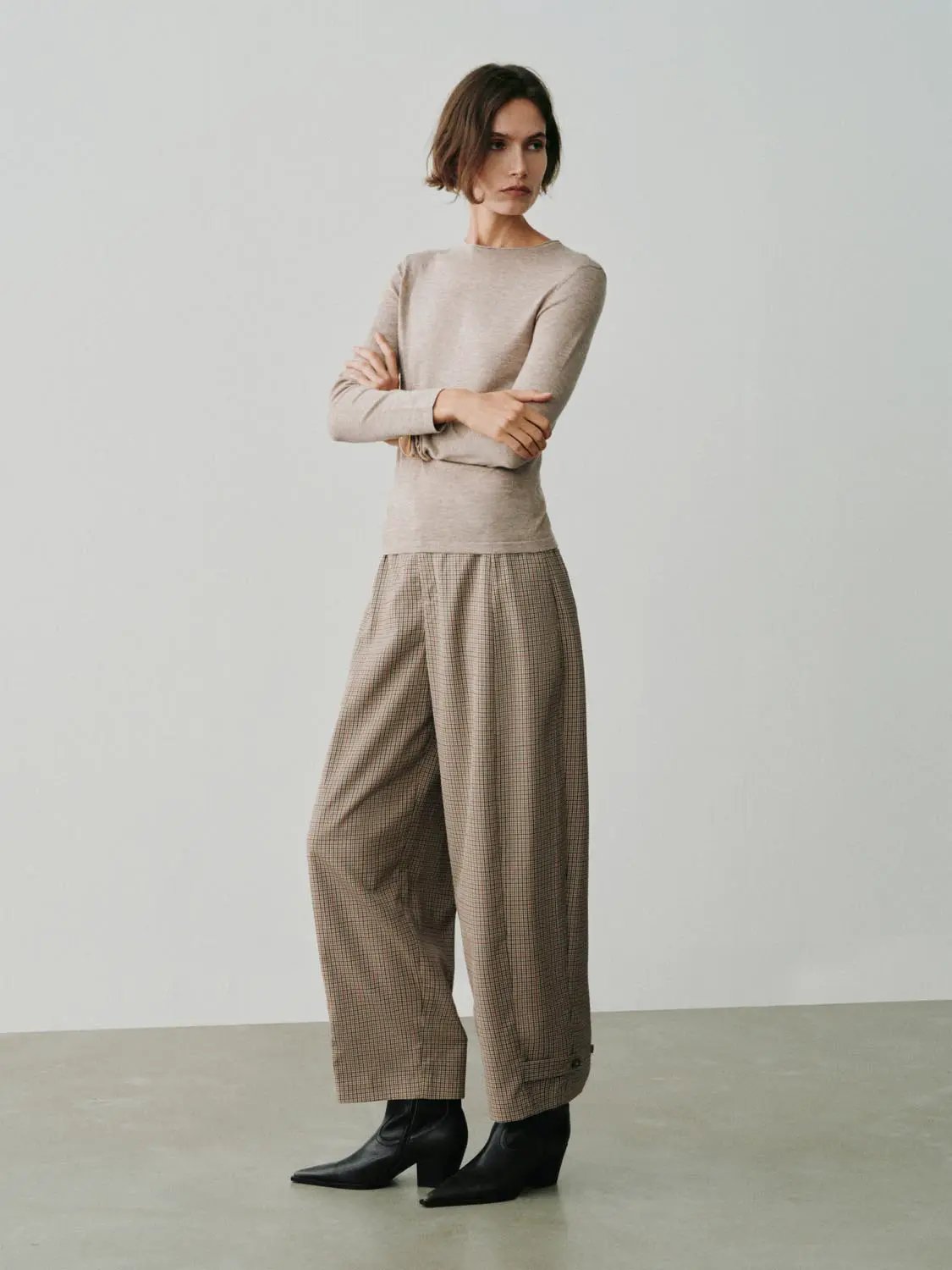 Knit T-Shirt by Urban Revivo Fashion; beige knitted top with wide-leg plaid pants.