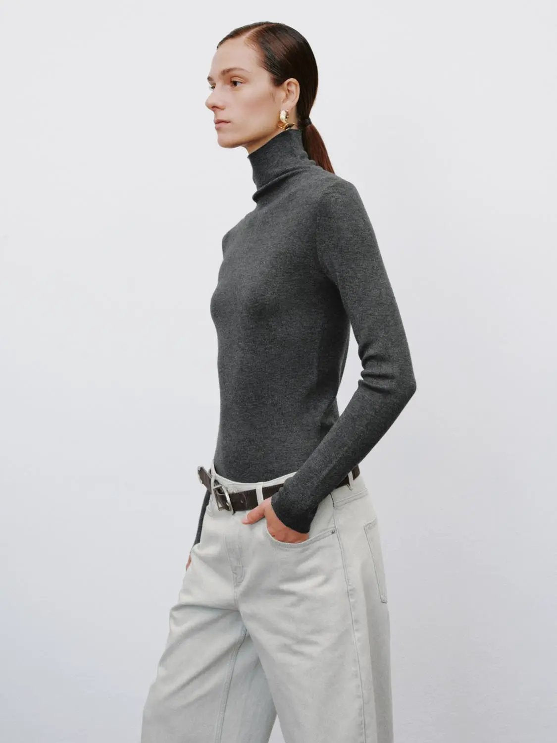 Ribbed fitted mock-neck long-sleeve sweater in charcoal gray knit.