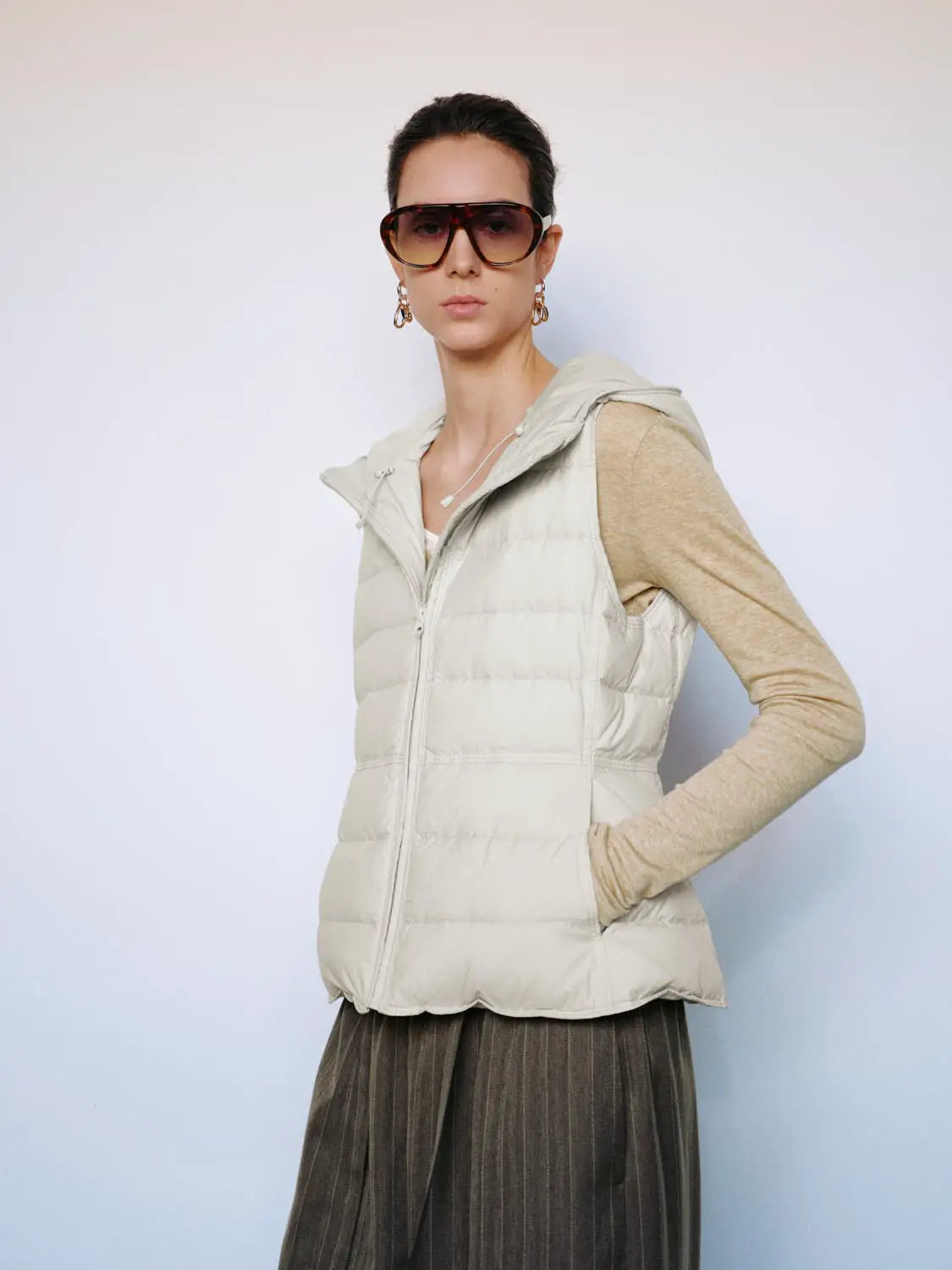 Down jacket vest in beige by Urban Revivo Fashion with quilted panels and zip front
