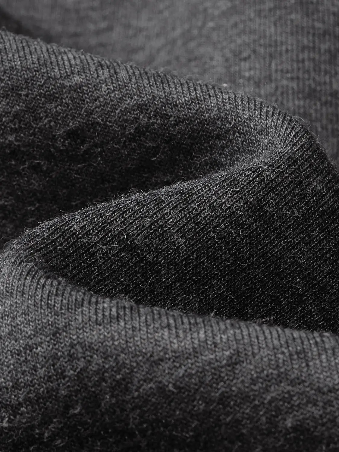 Sweatshirt jacket fabric close-up in black knit texture