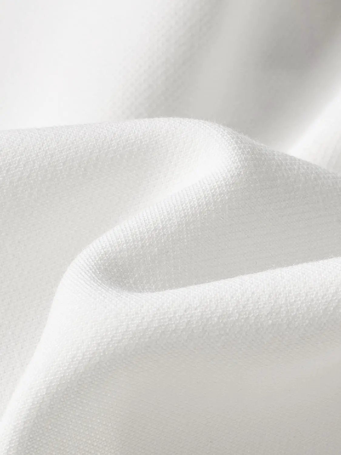 Camisole top in white fabric with smooth sheen and subtle texture.