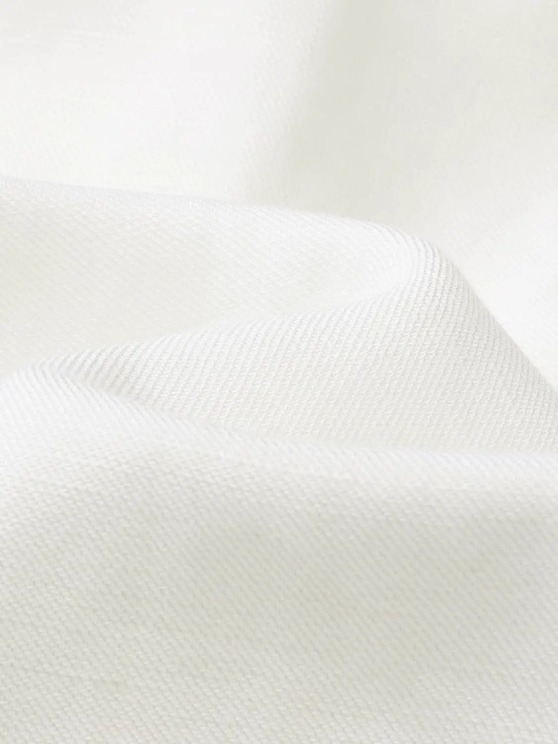 Button-front shirt white fabric close-up texture macro shot