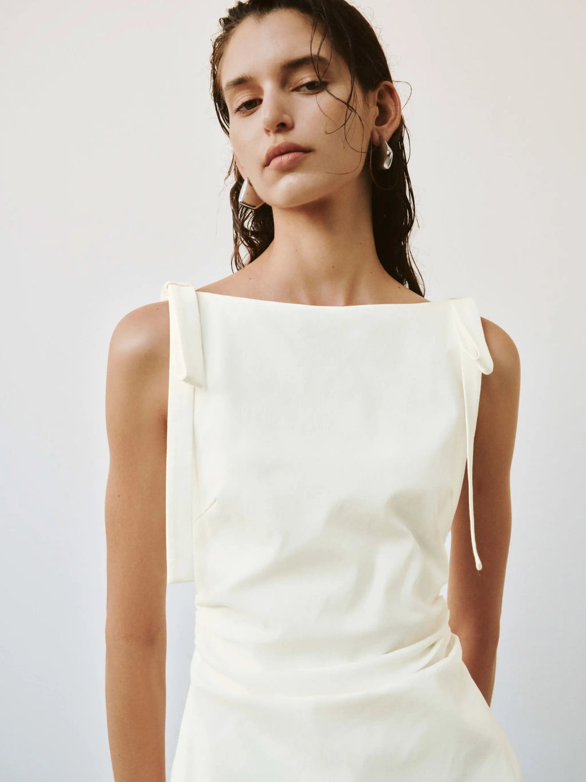 Viscose-blend sleeveless A-line midi dress in white by Urban Revivo Fashion with a nipped waist.