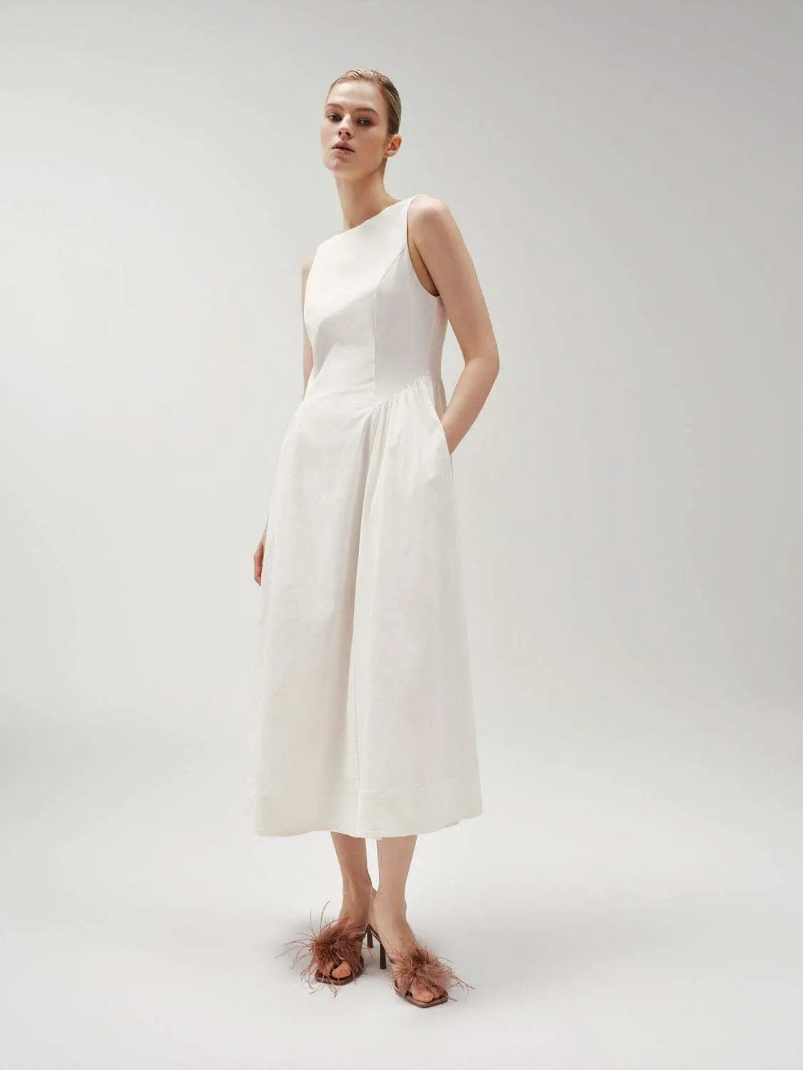 Crepe open-back sleeveless A-line midi dress in white with side pockets