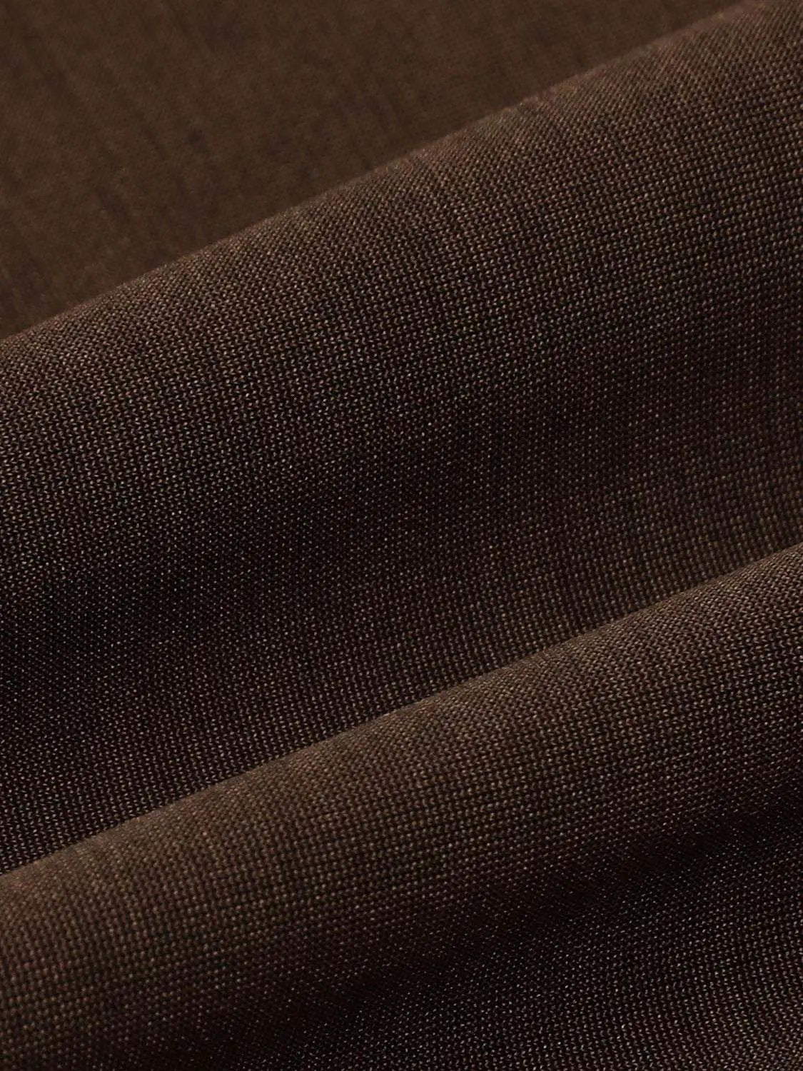 A-Line dresses in rich brown woven fabric close-up, showing texture and weave detail.
