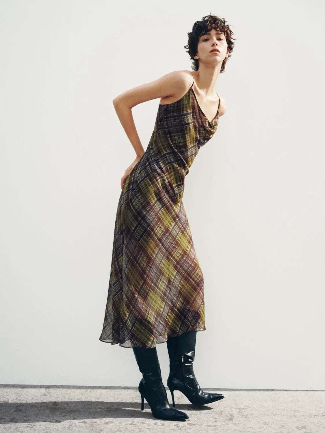 Plaid cowl-neck spaghetti-strap A-line dress in olive-brown plaid, midi length on model