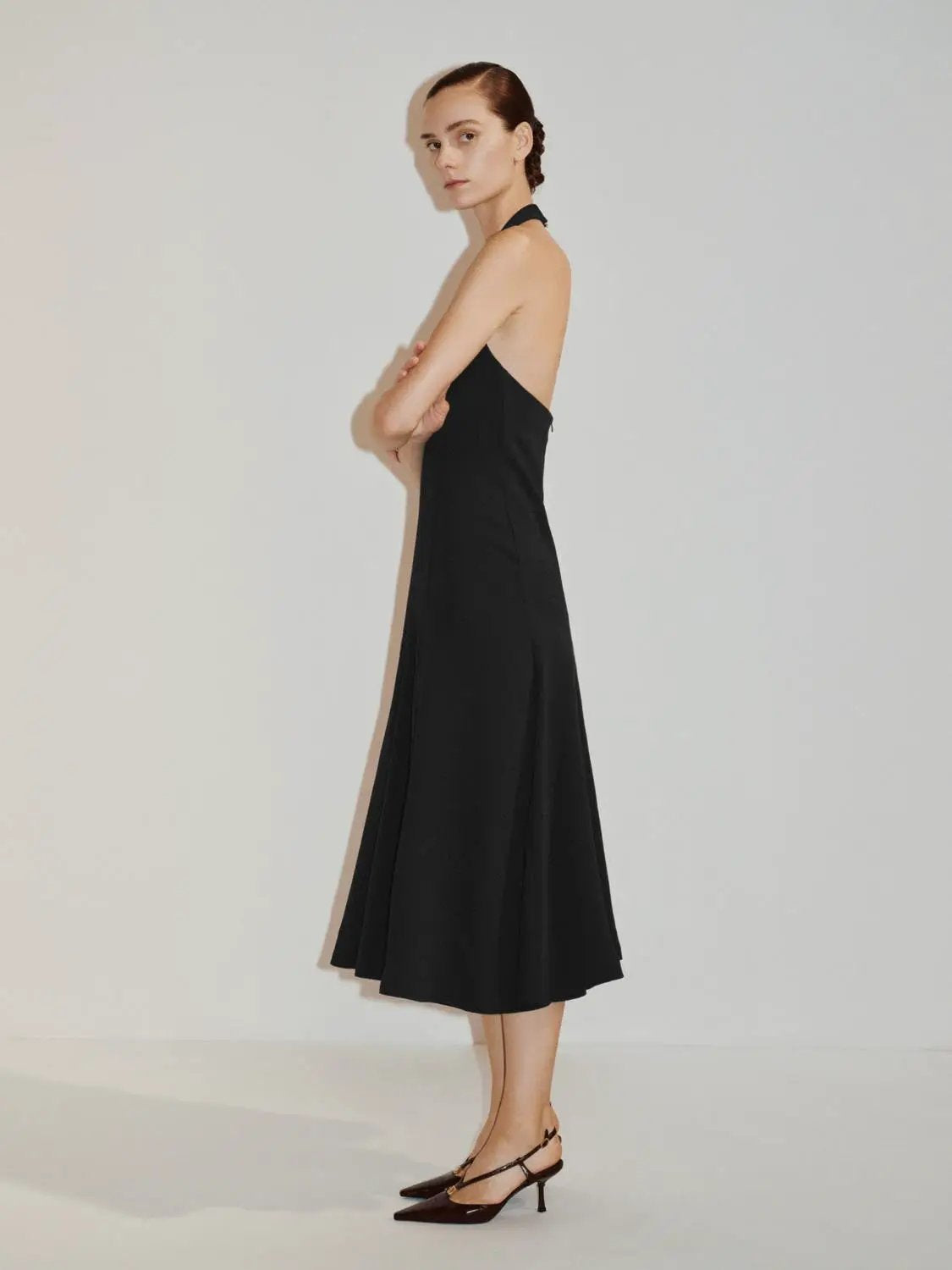 Fitted high-neck sleeveless A-line maxi dress by Urban Revivo Fashion in black.