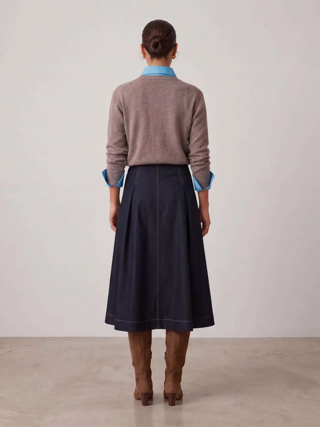 A-Line Midi Stretch Skirt in dark indigo denim with visible stitching