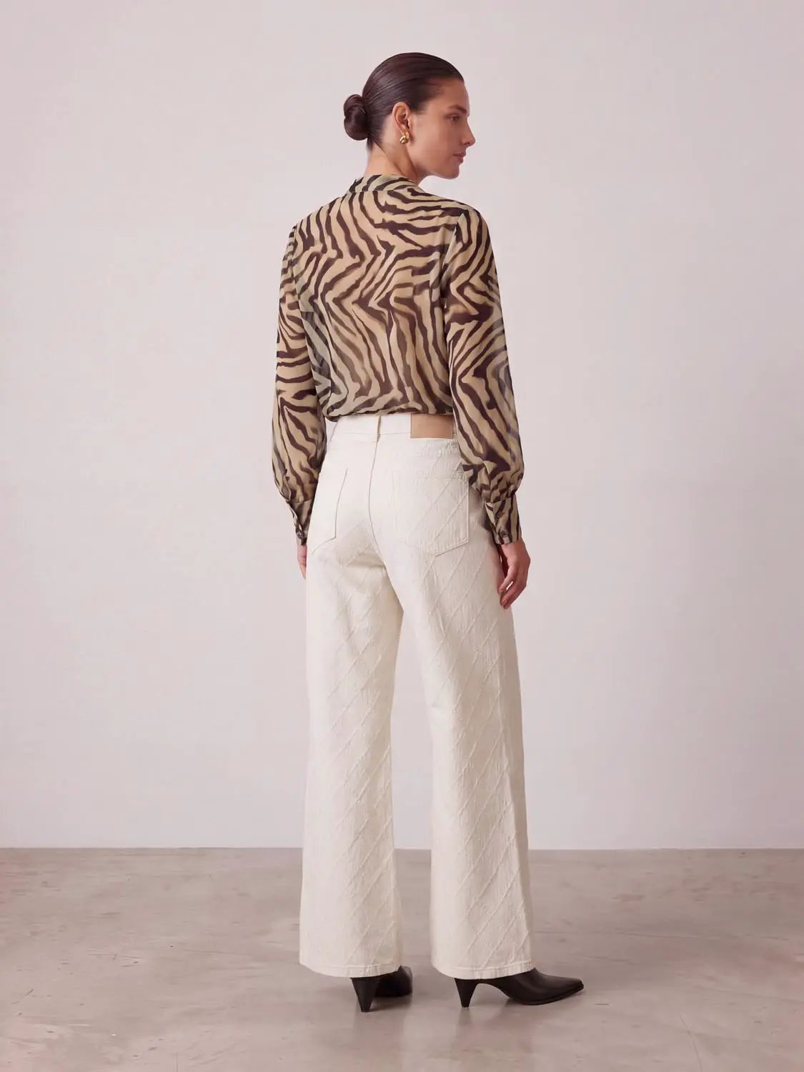 Mid Rise Textured Medium-Stretch Flare Leg Cotton Jeans in cream with back pockets