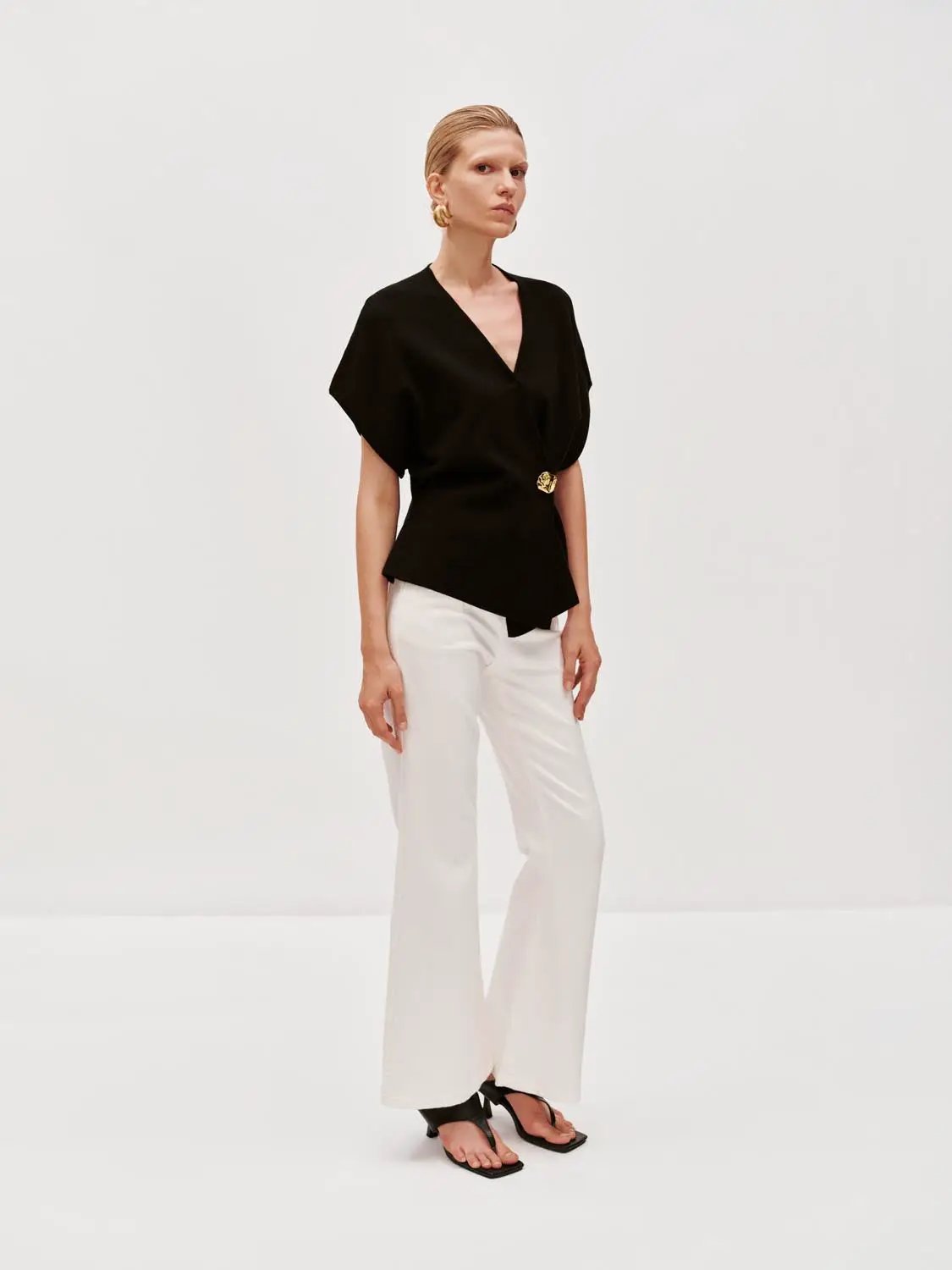 Wrap V-Neck Batwing Short Sleeve Knitted Cardigan in black with gold belt buckle.