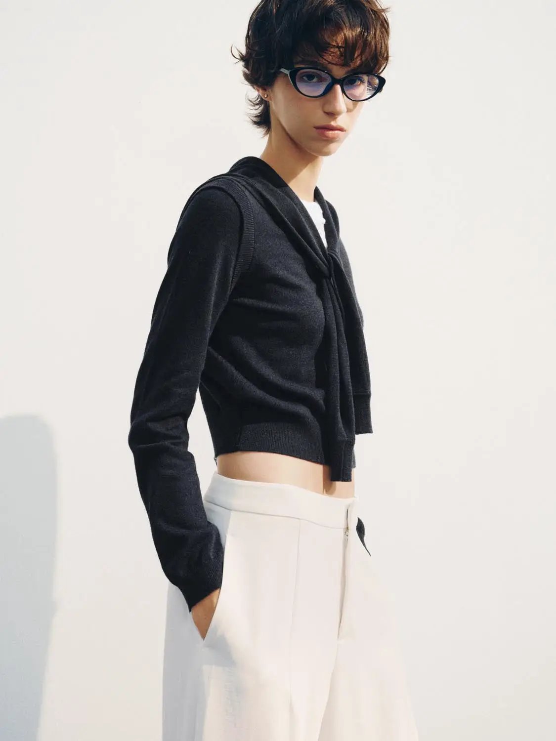 Knit T-Shirt, black cropped long-sleeve knit top on model with white pants