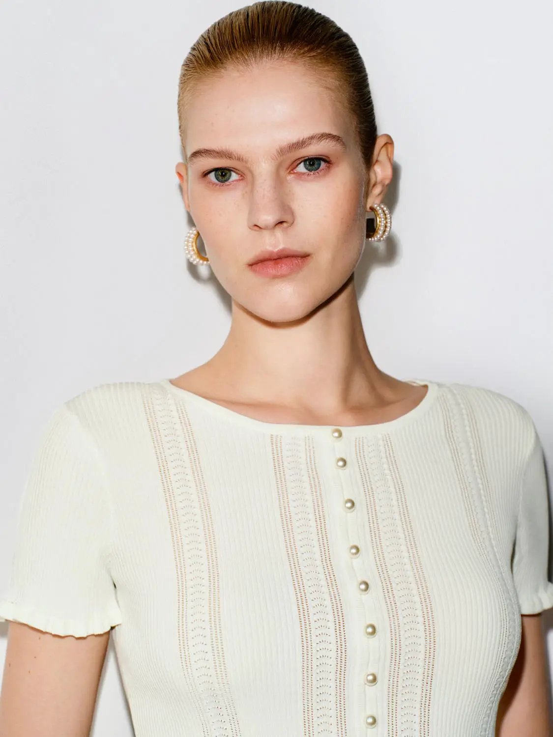 Crochet lace hem knit button-front shirt in cream with pearl buttons