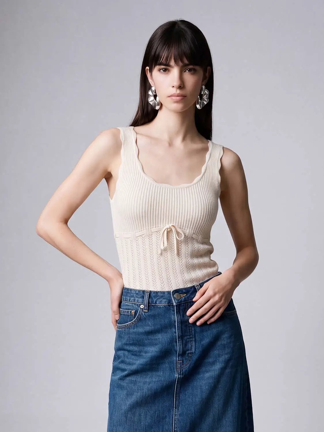 Knit T-Shirt cream ribbed sleeveless top with scalloped neckline and waist-tie detail