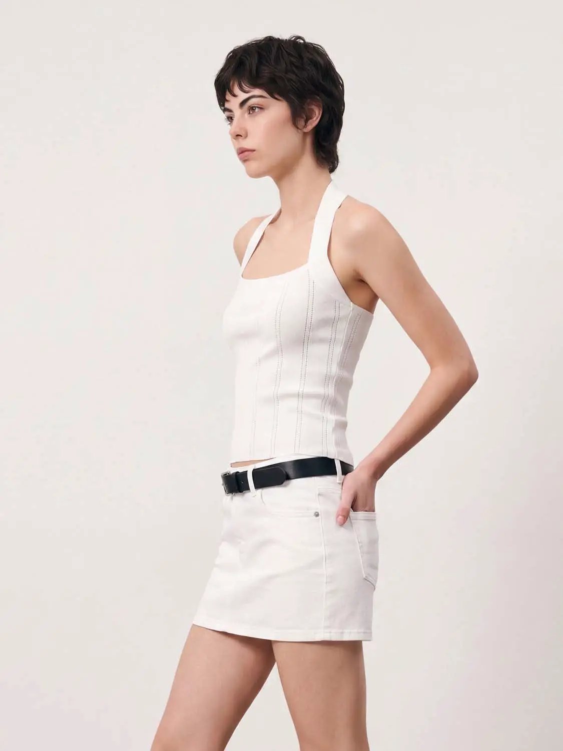 Knitted halter top by Urban Revivo Fashion; white sleeveless knit with vertical seam detailing.