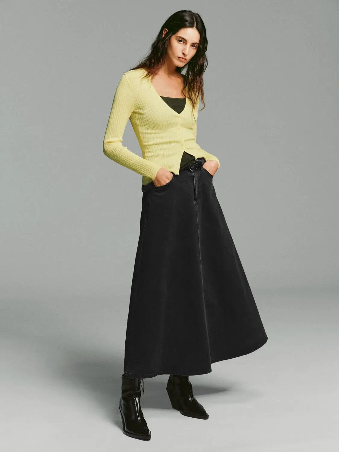 Ribbed button-front V-neck cardigan, pale yellow with long sleeves.