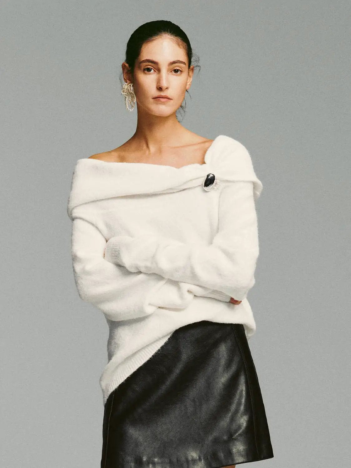Metal Button Asymmetric Draped Long Sleeve Sweater in white knit with off-shoulder neckline