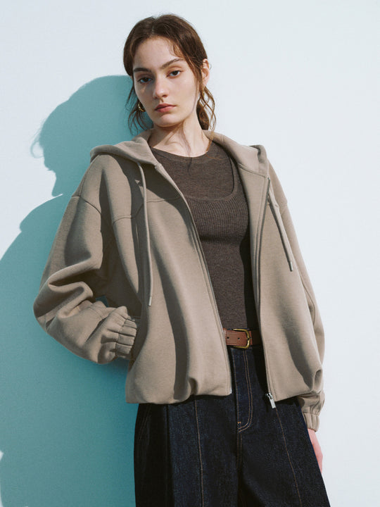 Giacca larga con cappuccio e cerniera frontale