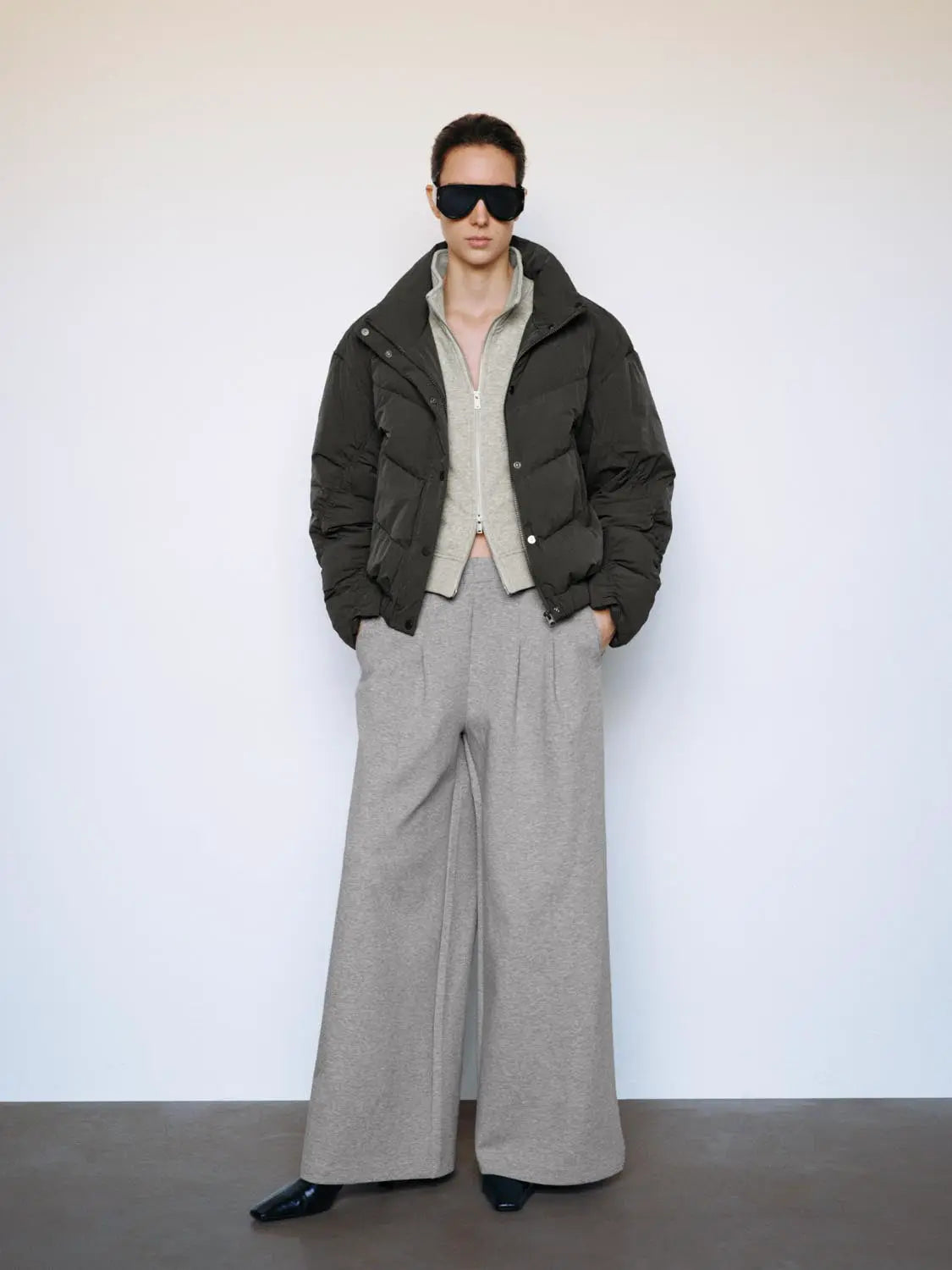Down jacket by Urban Revivo in dark olive; layered with grey zip cardigan and wide-leg grey pants, 3-piece outfit