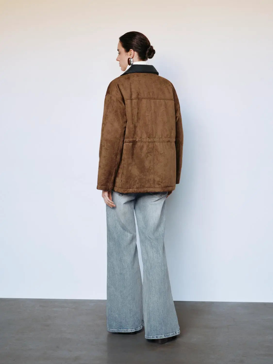 Padded jacket, brown suede-style fabric, back view on model