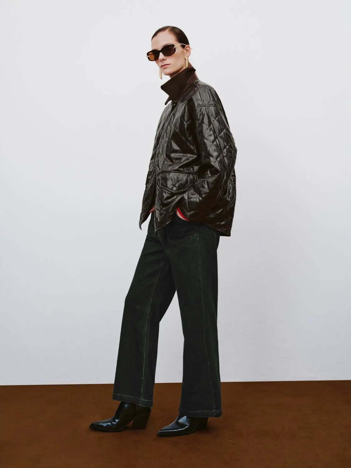 Padded jacket in glossy black quilted fabric with stand collar by Urban Revivo