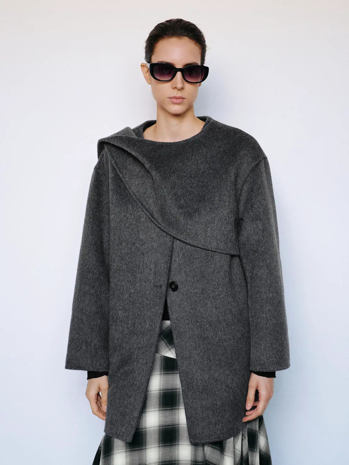 Coat in charcoal gray wool with oversized draped collar and single button closure