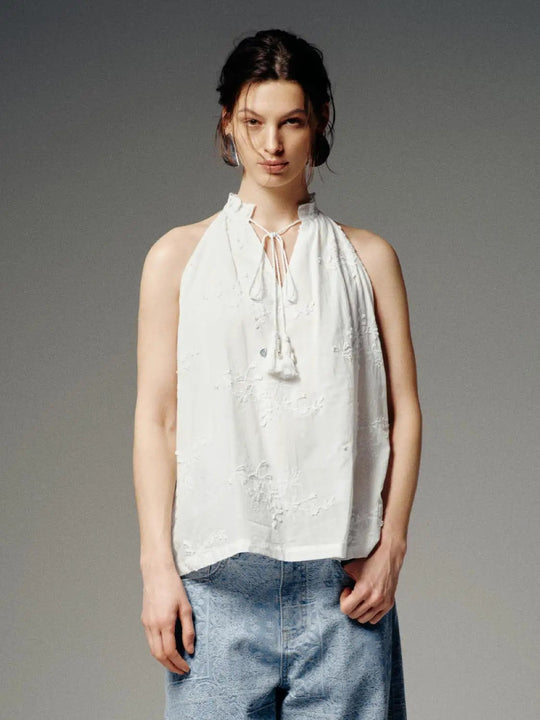 Camicia senza maniche con collo a fiocco e ricamo floreale, da infilare dall'alto