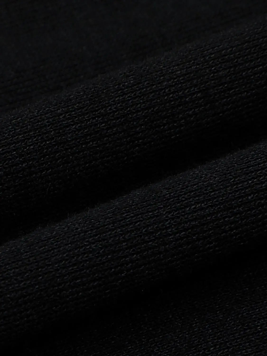 T-Shirt fabric close-up in black knit texture by Urban Revivo Fashion