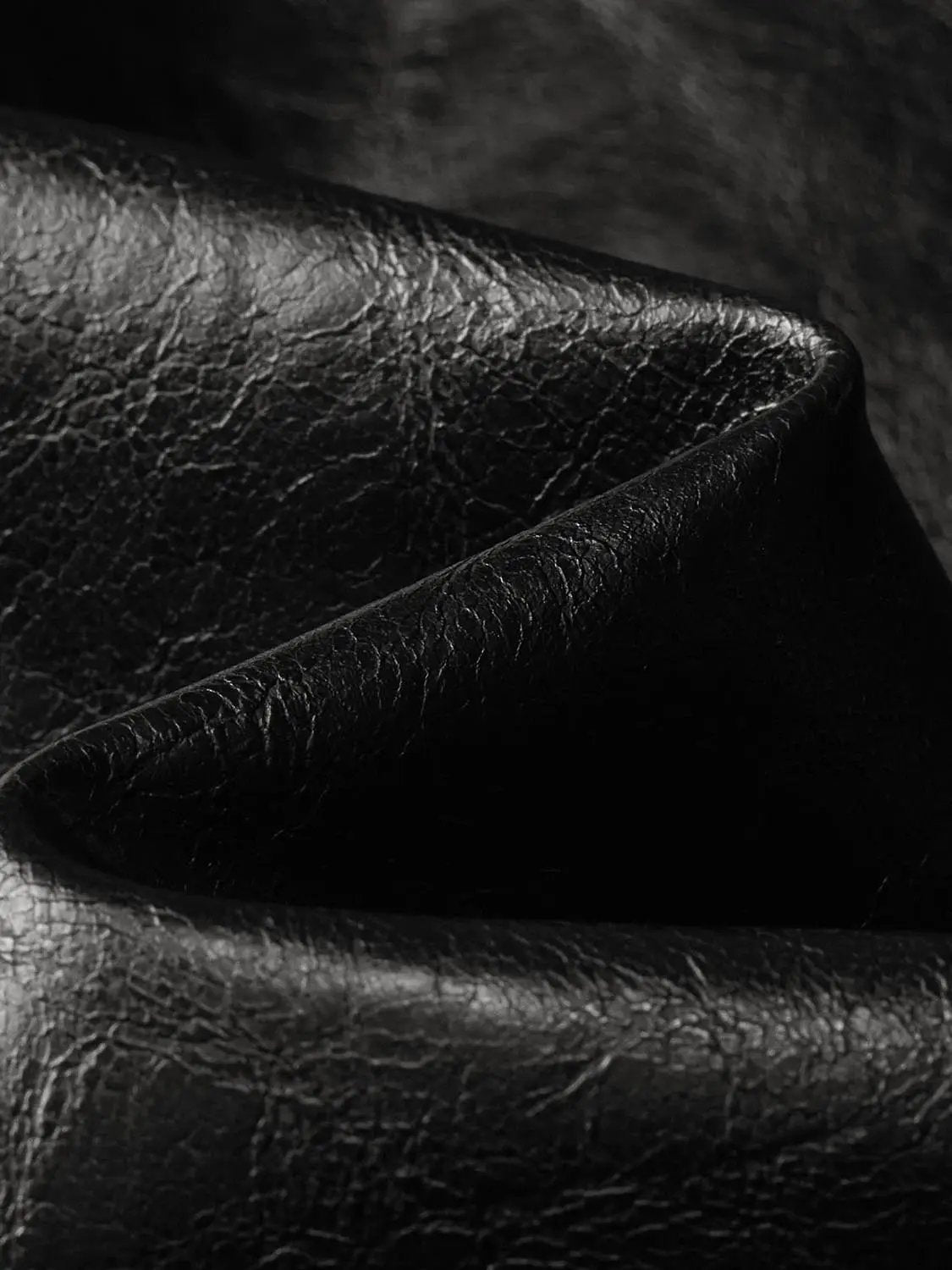 A-Line Skirt, black textured leather material close-up