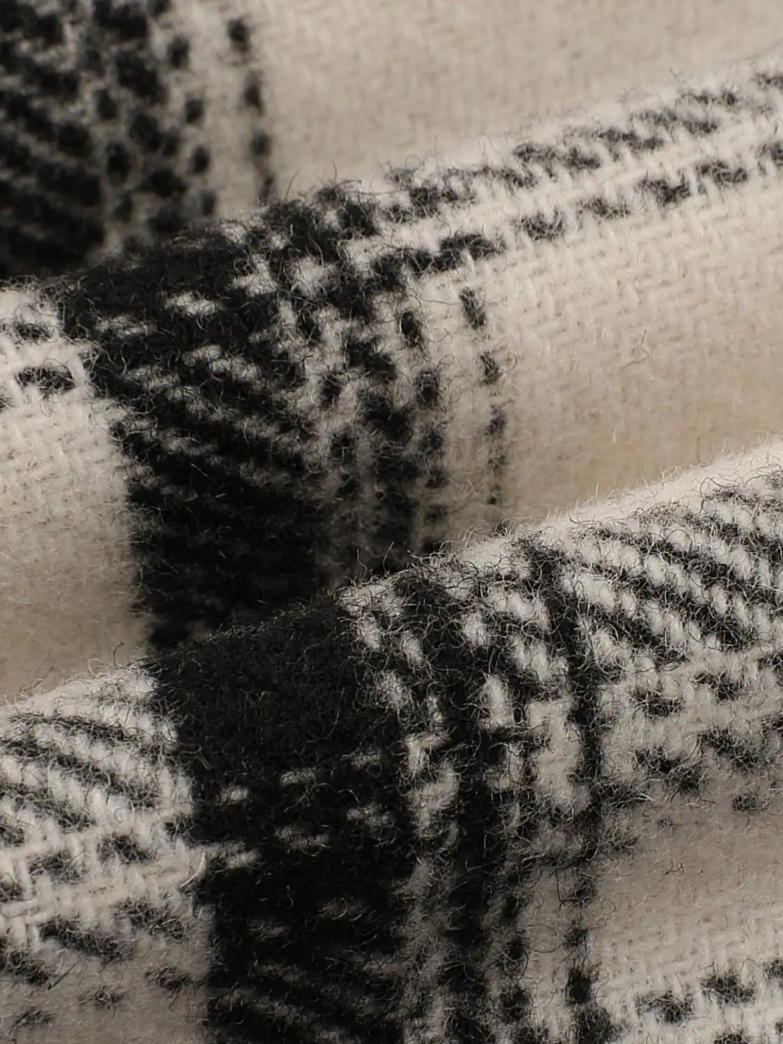 A-Line Skirt fabric close-up in black and ivory plaid wool blend by Urban Revivo Fashion
