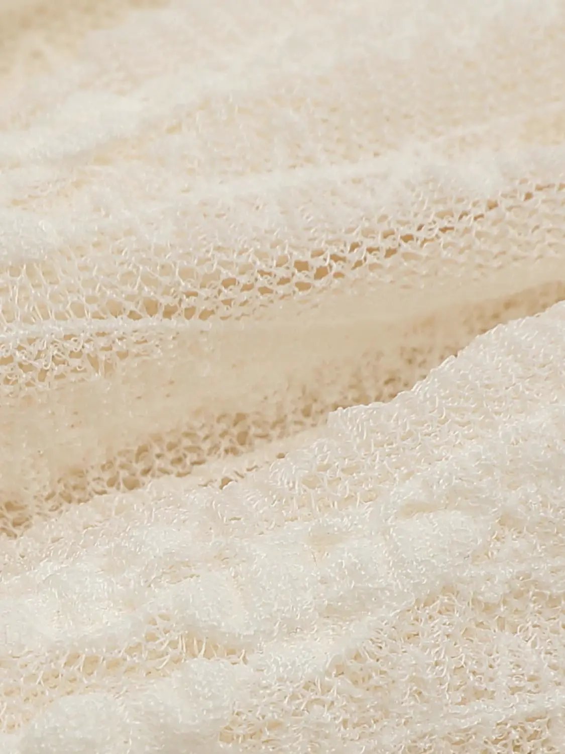 A-Line Dress beige lace fabric close-up with delicate texture.